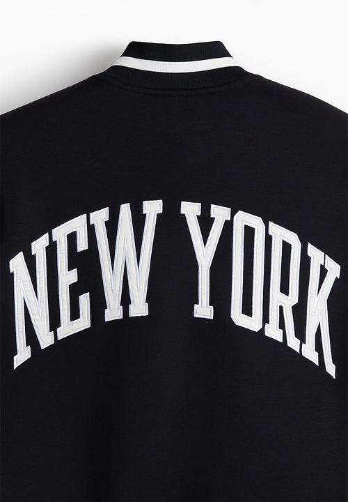 H&M - Loose fit baseball jacket - black/white