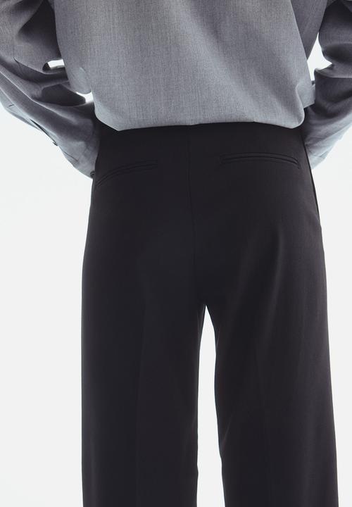 H&M - Straight trousers - black