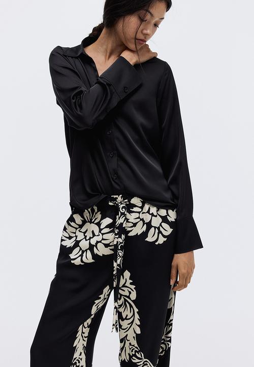 H&M - Wide trousers - black/patterned