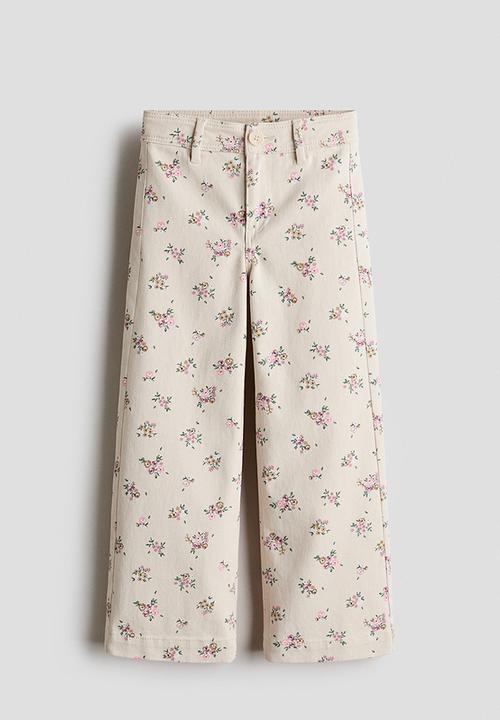 H&M - Wide patterned twill trousers - light beige/floral