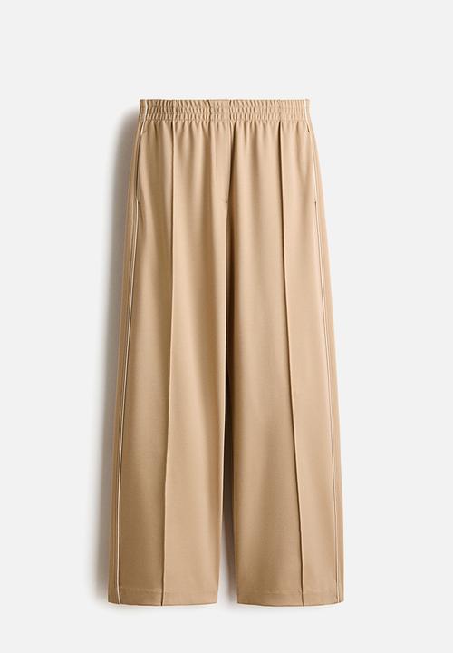 H&M - Wide crease-front trousers - beige