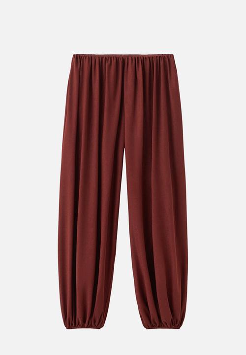 MANGO - Trousers corini - rust/copper
