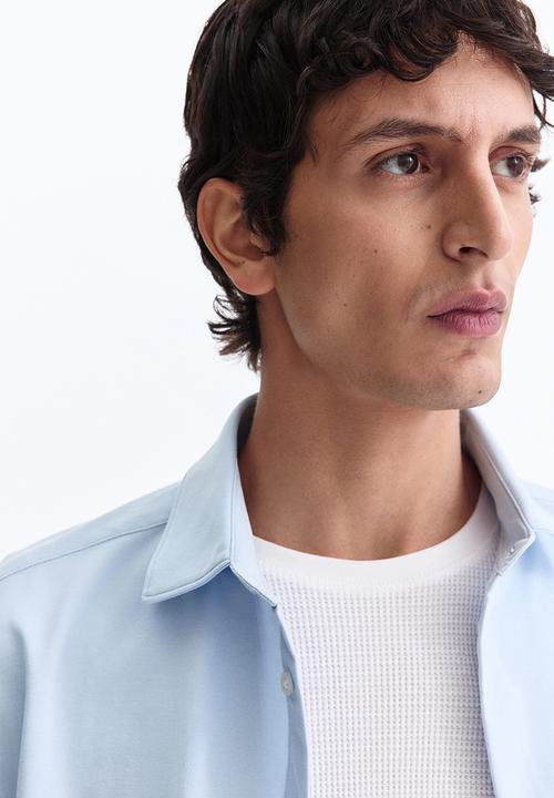 H&M - Four-way stretch slim fit shirt - light blue