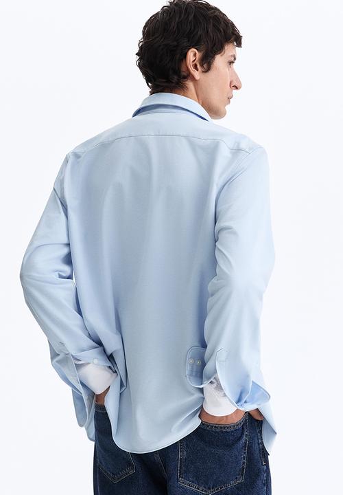 H&M - Four-way stretch slim fit shirt - light blue