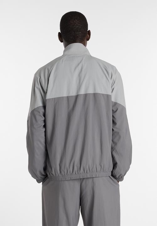 New Balance  - NB Athletics Sport Legacy Jacket - Grey