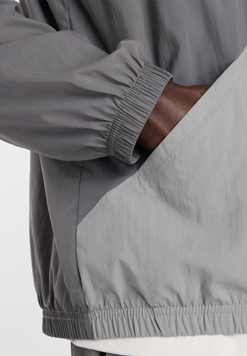 New Balance  - NB Athletics Sport Legacy Jacket - Grey