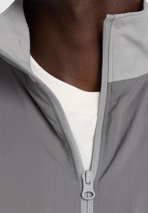 New Balance  - NB Athletics Sport Legacy Jacket - Grey