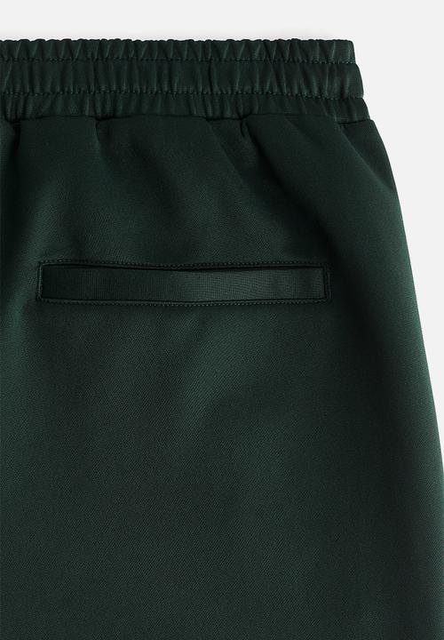 H&M - Relaxed fit sweatpants with side stripes - dark green/colour block