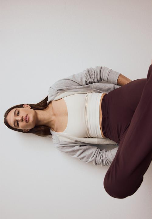 H&M - Flared yoga leggings with softmove? - chocolate plum purple