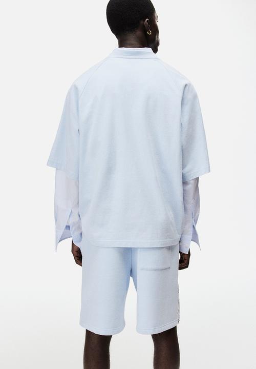 H&M - Lotto H&M: Regular fit sweatshorts - light blue/lotto