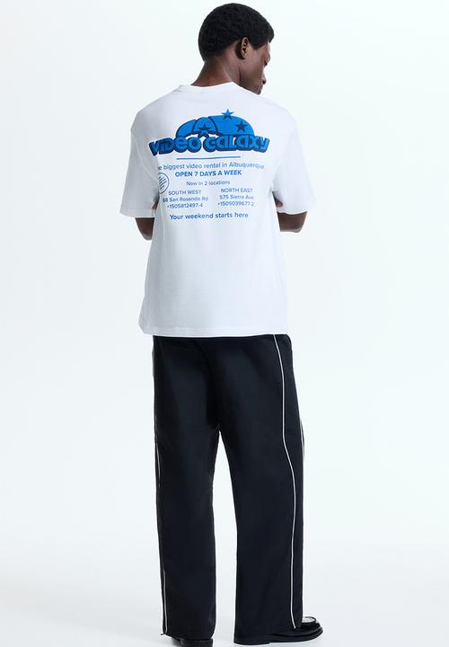 H&M - Loose fit printed T-shirt - white/video galaxy