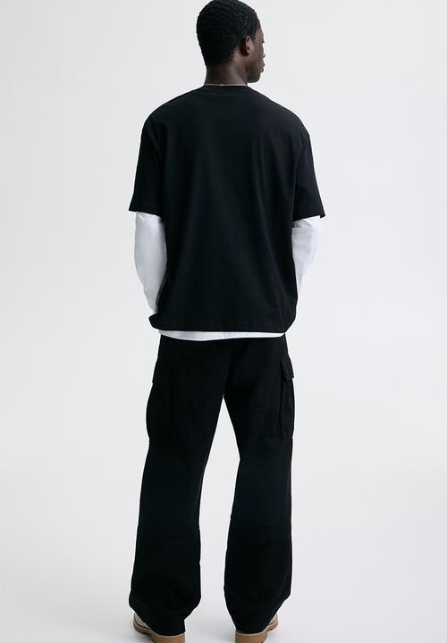 H&M - Loose fit printed t-shirt - black/golden sunset