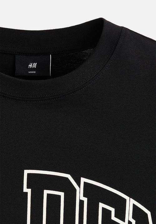 H&M - Loose fit printed t-shirt - black/golden sunset