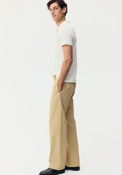 H&M - Slim fit jacquard-knit polo shirt - cream