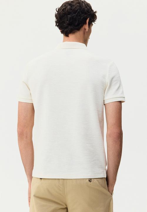H&M - Slim fit jacquard-knit polo shirt - cream