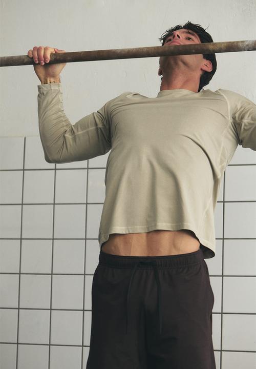 H&M - Regular fit long-sleeve sports top with drymove - light beige