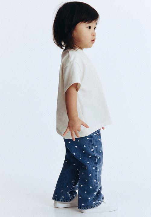 H&M - Flared leg jeans - denim blue/hearts