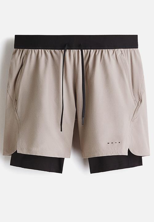 H&M - Double-layered sports shorts with drymove™ - beige/black