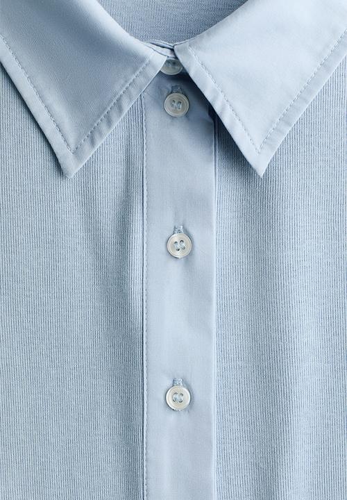 H&M - Fitted polo shirt - light blue