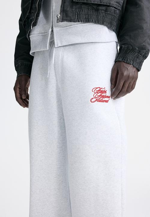 H&M - Loose fit sweatpants - light grey marl/fortes fortuna