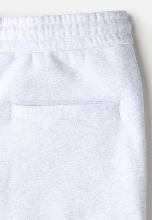 H&M - Loose fit sweatpants - light grey marl/fortes fortuna