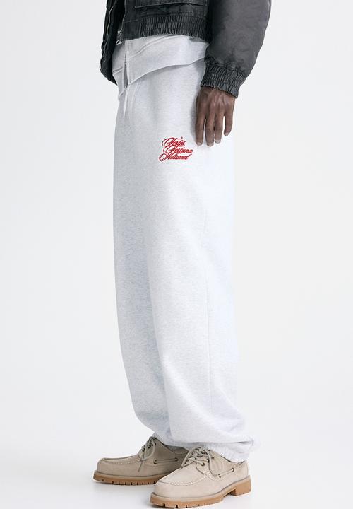 H&M - Loose fit sweatpants - light grey marl/fortes fortuna