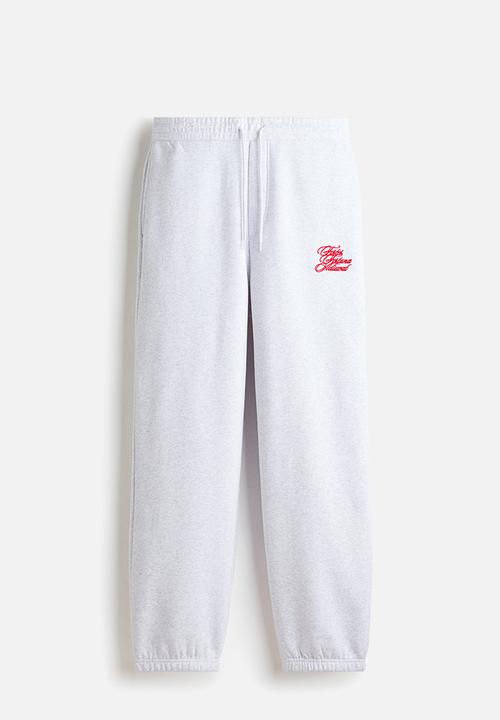 H&M - Loose fit sweatpants - light grey marl/fortes fortuna