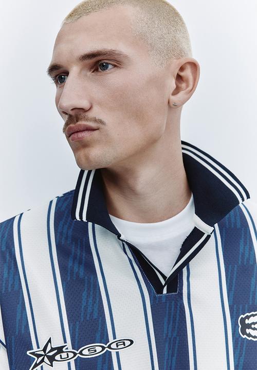 H&M - Loose fit football shirt - dark blue/run wild