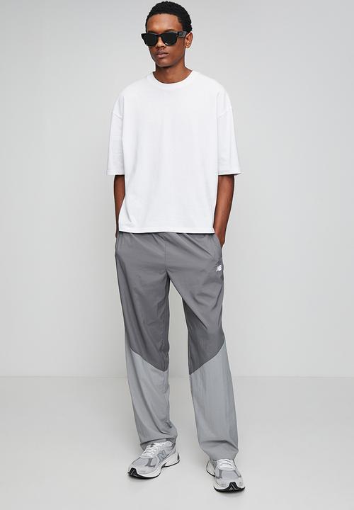 New Balance  - NB Athletics Sport Legacy Pant - Grey