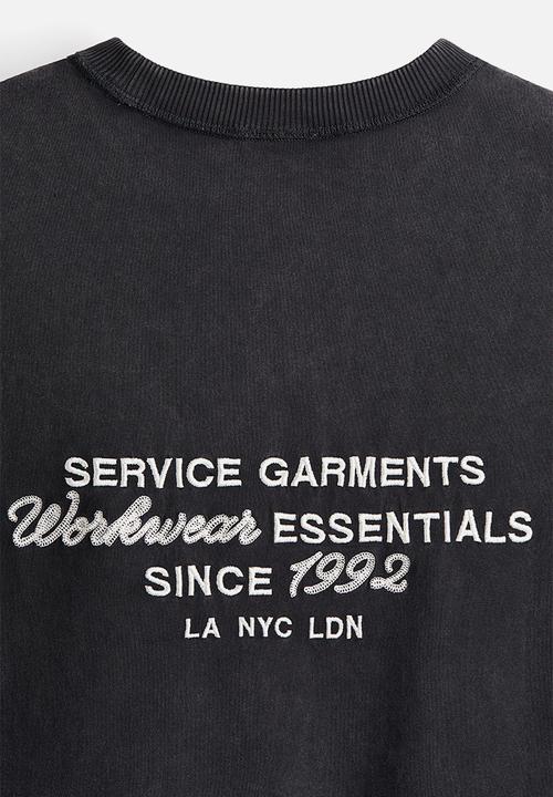 H&M - Loose fit printed T-shirt - black/workwear