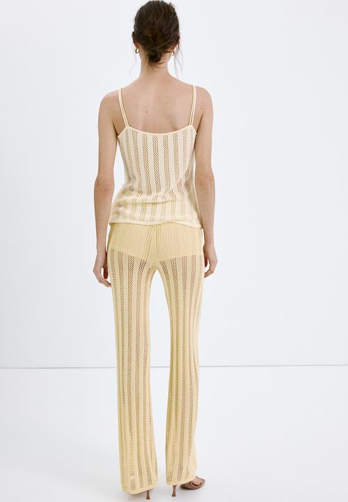 MANGO - Trousers lolai - light/pastel yellow