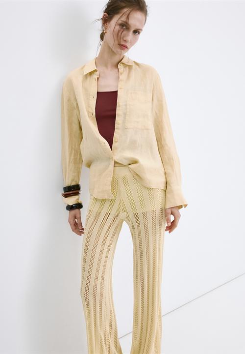 MANGO - Trousers lolai - light/pastel yellow