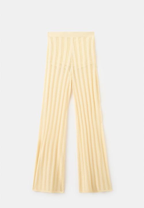 MANGO - Trousers lolai - light/pastel yellow