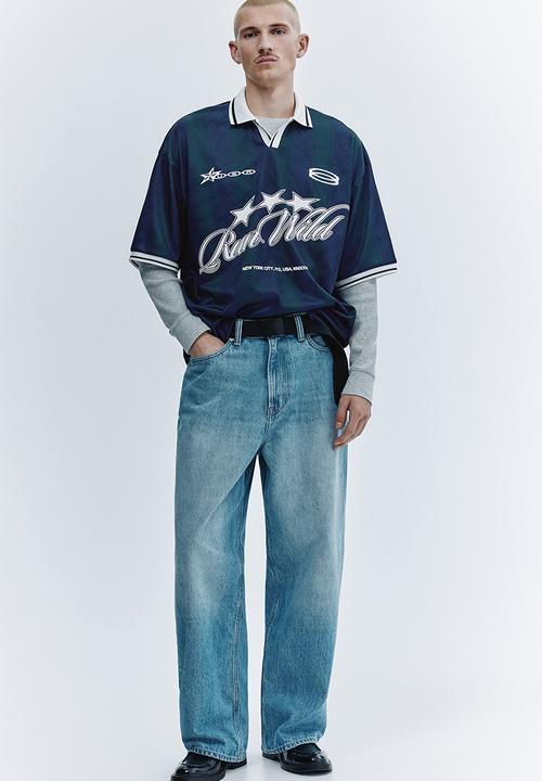 H&M - Loose fit football shirt - dark blue/run wild