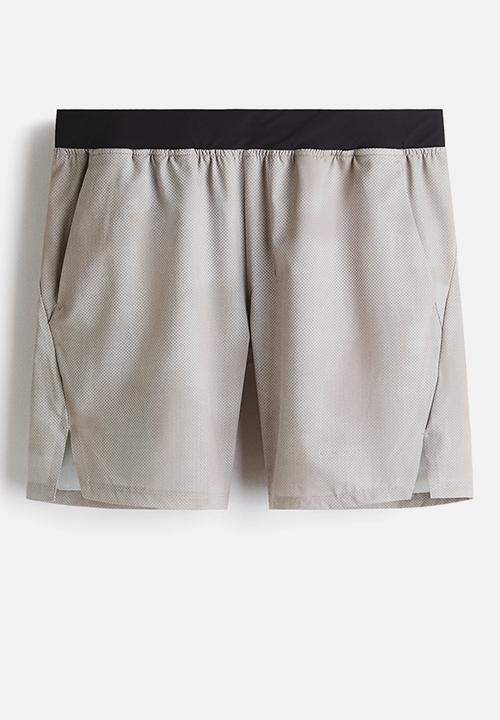 H&M - Mid-length sports shorts with drymove - light beige