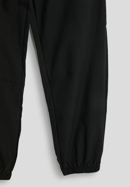 Pop Candy - Tracksuit pants - black