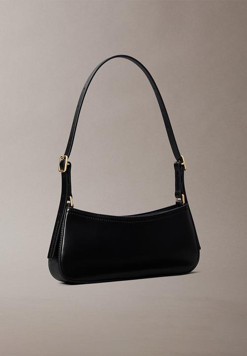Calvin Klein - Ck small shoulder bag- black / antique light gold
