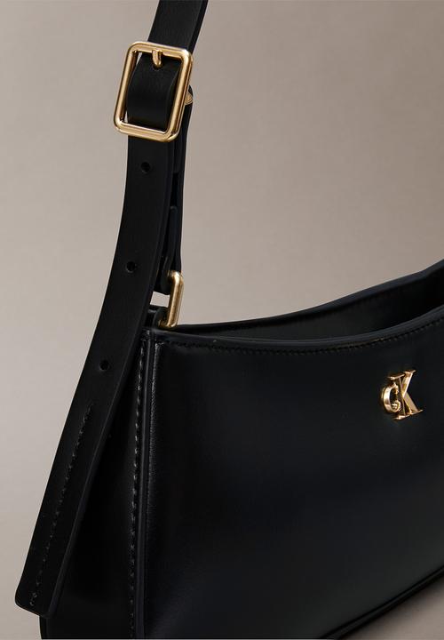 Calvin Klein - Ck small shoulder bag- black / antique light gold