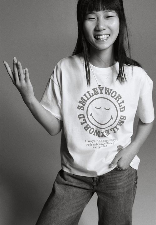 H&M - Printed cotton T-shirt - light yellow/smileyworld