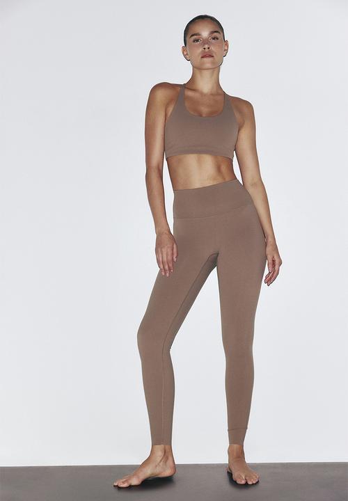 H&M - Sculptmove? high-waisted leggings - beige