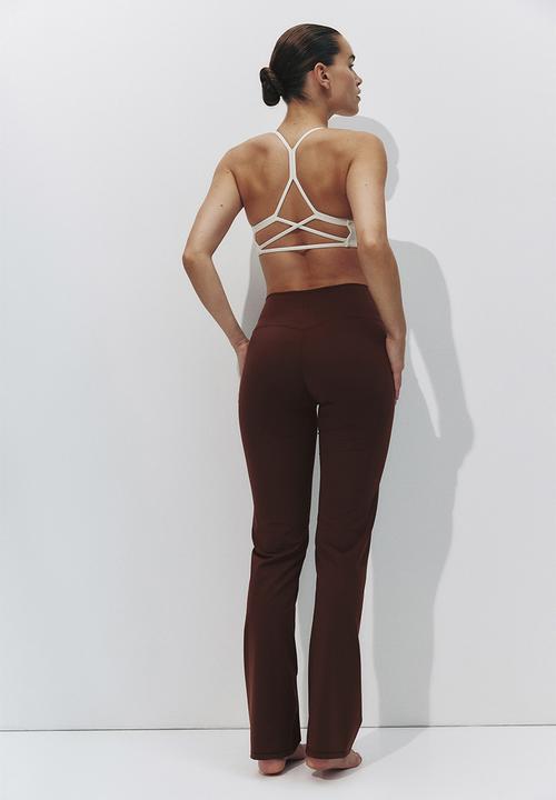 H&M - Sculptmove™ flared sports leggings - brown