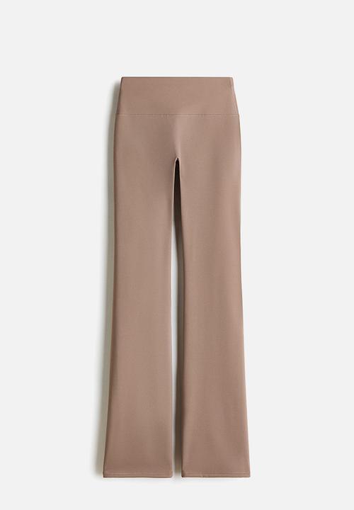 H&M - Sculptmove™ flared sports leggings - beige