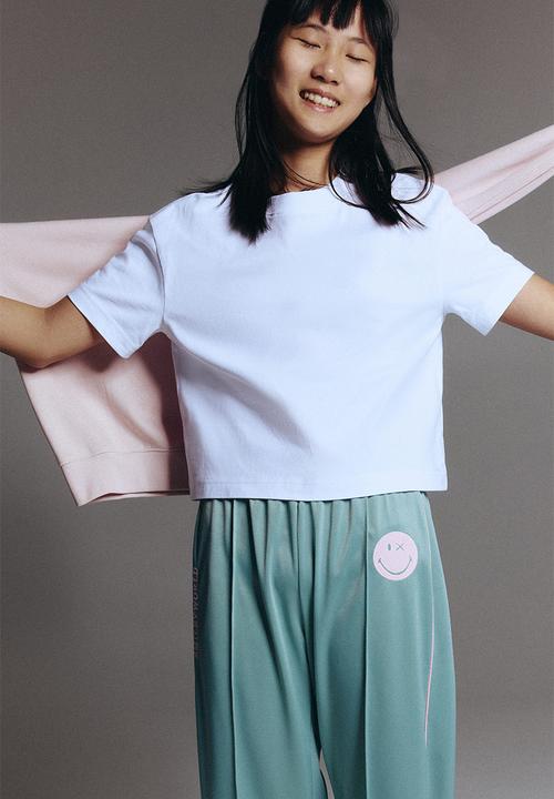 H&M - Wide-leg track pants - light green/smileyworld?