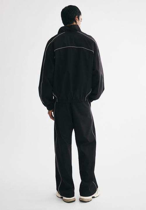 H&M - Relaxed fit track pants - black