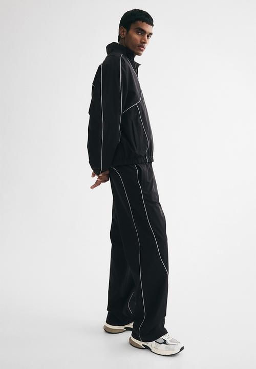H&M - Relaxed fit track pants - black