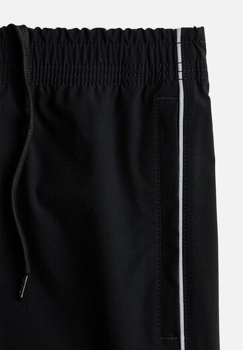 H&M - Relaxed fit track pants - black