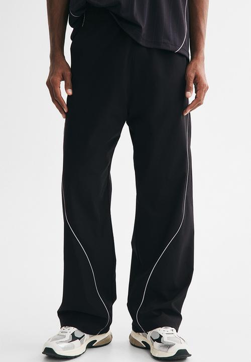 H&M - Relaxed fit track pants - black