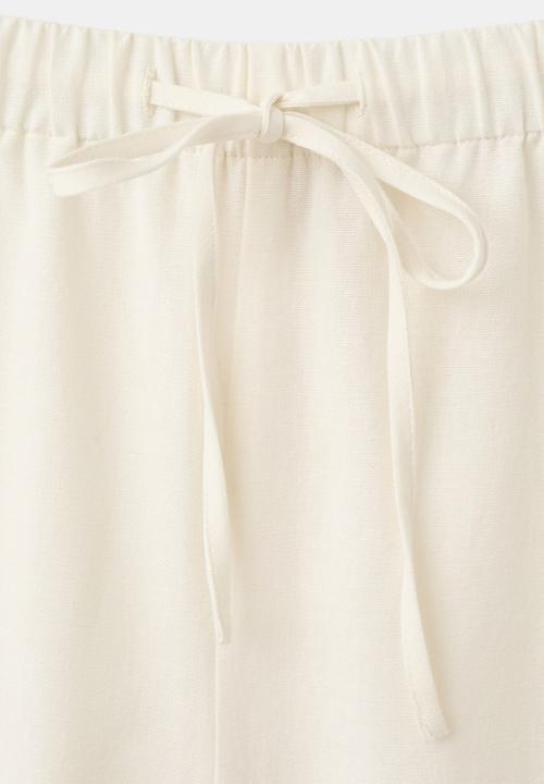 MANGO - Trousers daria - natural