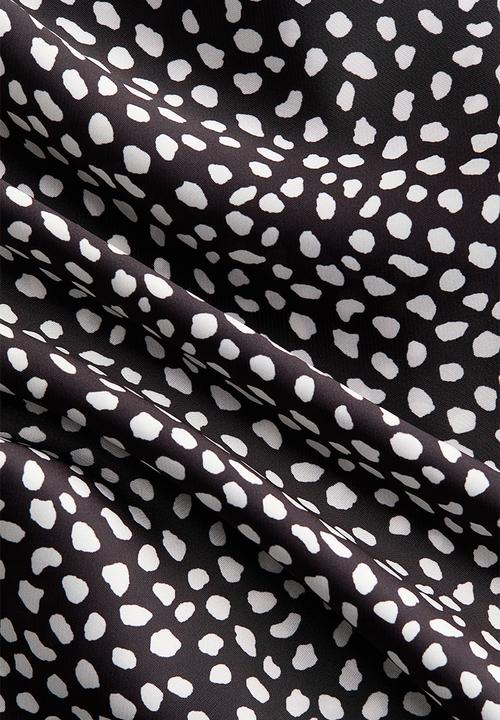 H&M - Skirt-layered trousers - black/spotted