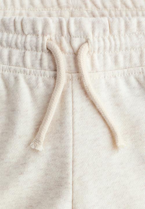H&M - Flared joggers - light beige marl